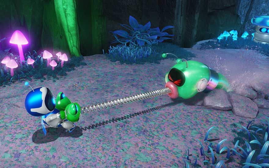 Un petit robot tire sur un ver vert à ressort dans une forêt magique entourée de champignons fluorescents.