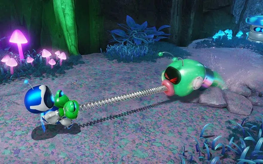 Un petit robot tire sur un ver vert à ressort dans une forêt magique entourée de champignons fluorescents.