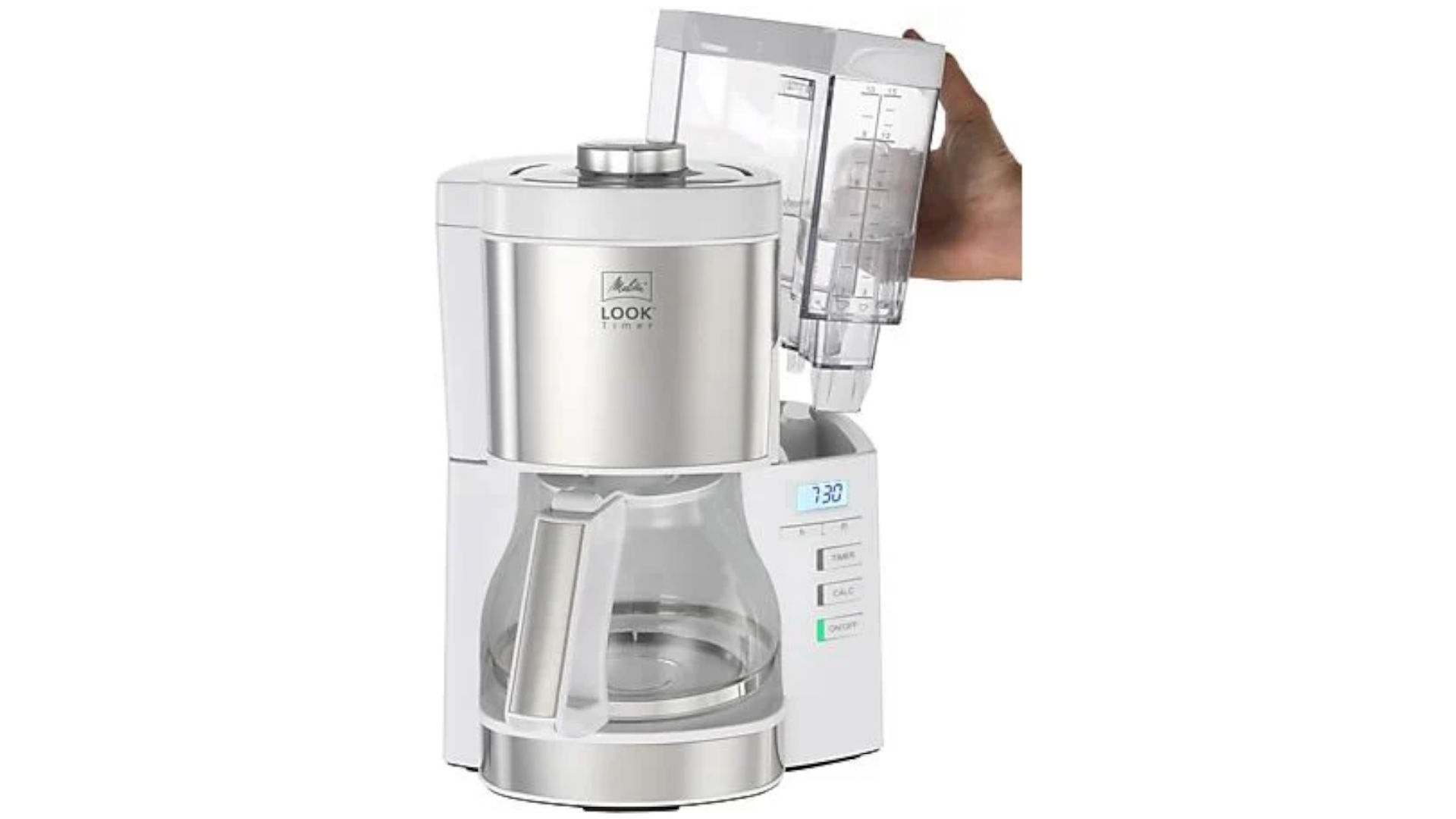 A white Melitta coffee maker with a glass jug and a hand holding a water reservoir.