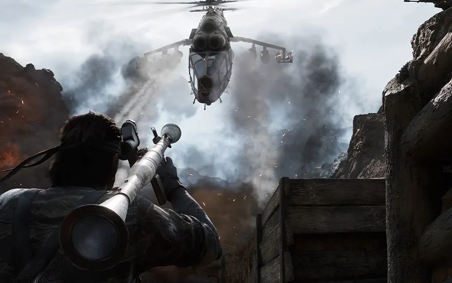 Soldat avec lance-roquettes vise hélicoptère au-dessus terrain rocheux avec fumée et explosions.