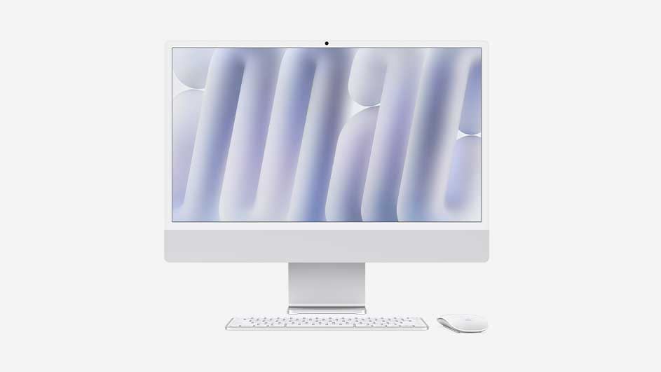 Witte iMac met bijpassend toetsenbord en muis, scherm gevuld met zachte paarse en blauwe vormen die een moderne, luchtige bureausfeer creëren.