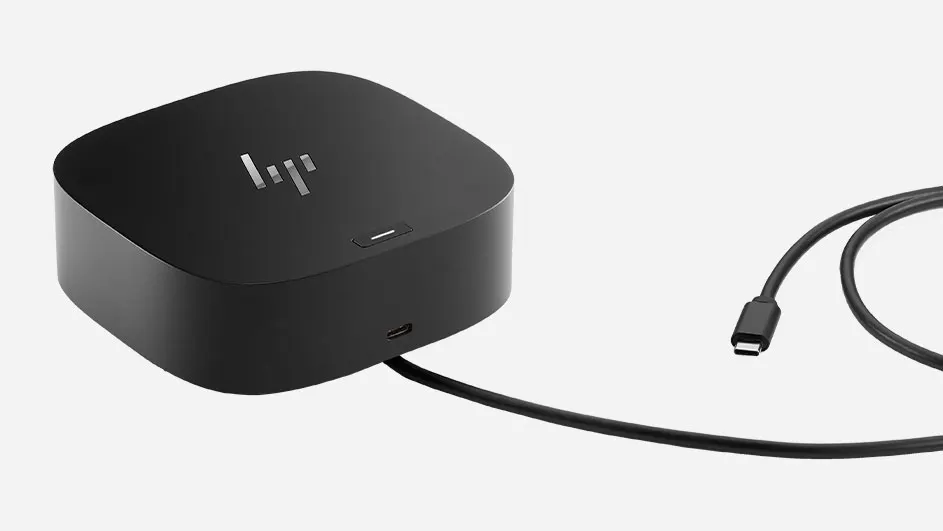 Black docking station with USB-C port visible on the front, connected cable for laptop or device connections and charging.