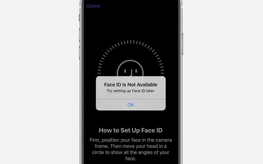 Écran de smartphone affichant un message d'erreur "Face ID non disponible" sur fond noir avec des instructions de configuration.