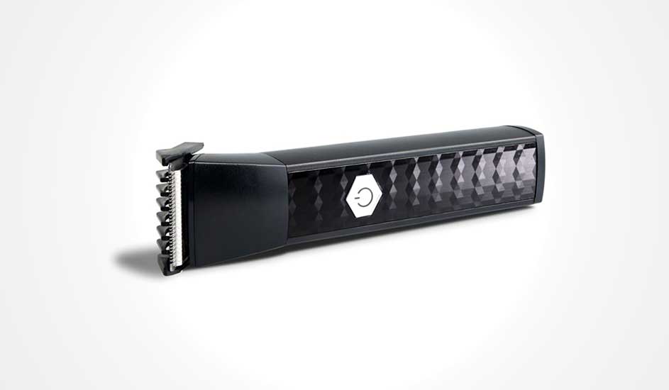  A modern black beard trimmer with a chequered pattern and a white on/off button is positioned diagonally on a white background.