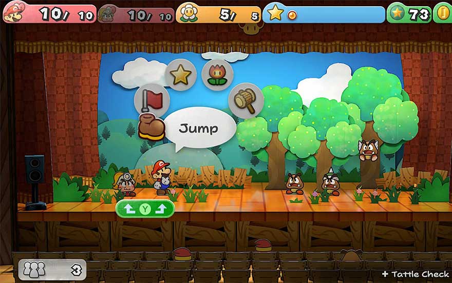 Scène de jeu vidéo sur scène avec des arbres verts, des nuages blancs sur un fond bleu ciel et divers objets de jeu.