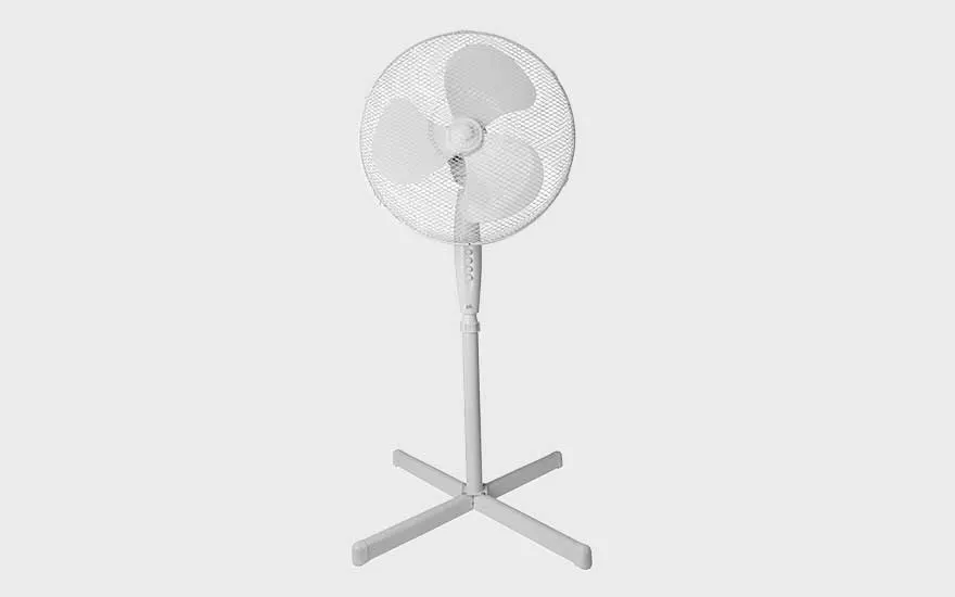A white pedestal fan with three blades and a grid cover stands against a plain background, simple and functional look.