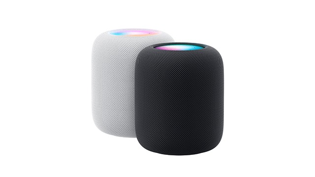 Deux Enceintes cylindriques : un blanc à gauche et un noir à droite, tous deux avec des dessus lumineux multicolores.