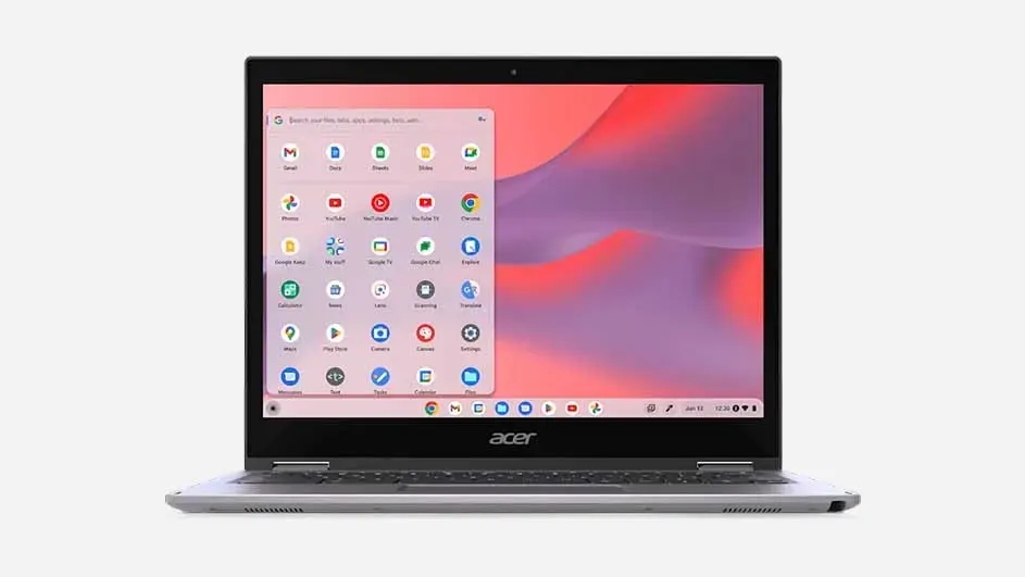 Een opengeklapte, grijze Acer-laptop toont een scherm met een app-menu en een roze-paarse achtergrond.