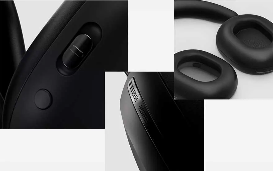 Zwart koptelefoon detailopname toont oorkussens, schuifregelaar, knop en ventilatieopeningen op een witte achtergrond.