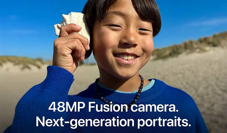 Smiling child in blue sweater holding seashell to ear on beach with text about 48MP Fusion camera and portraits.