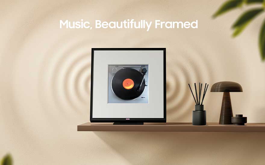 A modern room with a shelf displaying a frame featuring a record player. Decorative objects sit nearby with soft lighting accents.