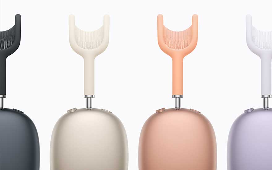 A row of four headphones in dark grey, beige, peach and lilac, highlighting the rounded ear cups and slender mesh headbands from bovenaf.