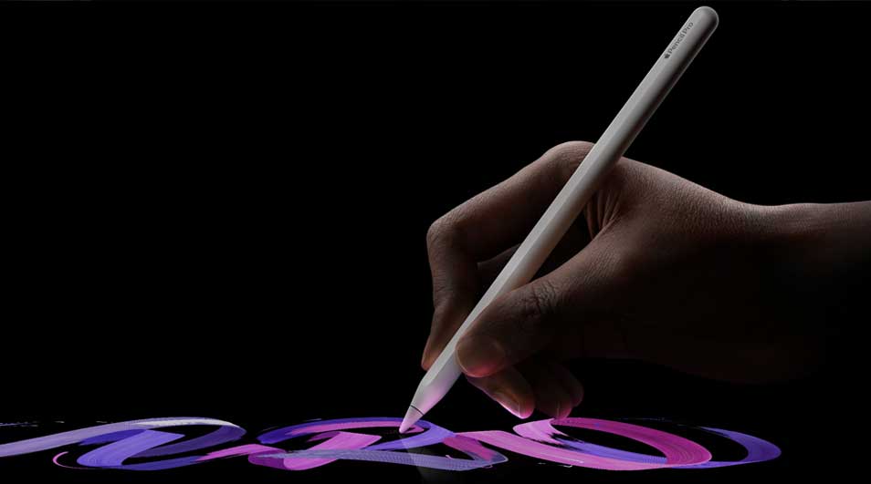 A hand draws with a digital pen on a black screen, creating flowing purple and pink shapes in a sleek, modern scene.