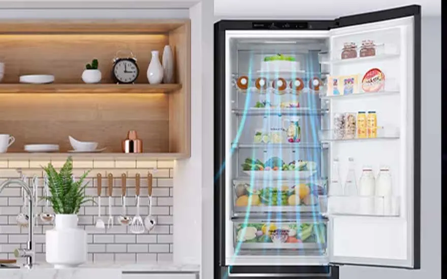 An open fridge full of bottles, jars and food stands beside a tidy kitchen area, with blue lines showing cooling or air flow.