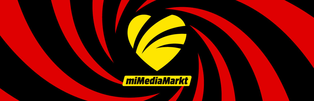 Corazón amarillo estilizado con detalles negros sobre fondo en espiral rojo y negro, con el texto “miMediaMarkt” en una franja amarilla en la parte inferior.