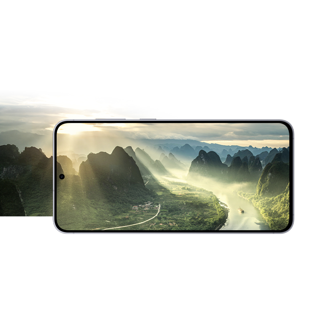 Un smartphone Samsung en position horizontale montrant une vue panoramique des montagnes et de la rivière illuminées par le soleil.