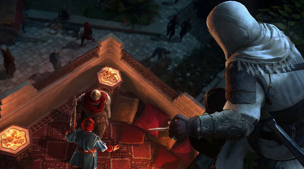 Vista elevada de un edificio con figuras vestidas de blanco, rojo y azul en un entorno urbano nocturno.