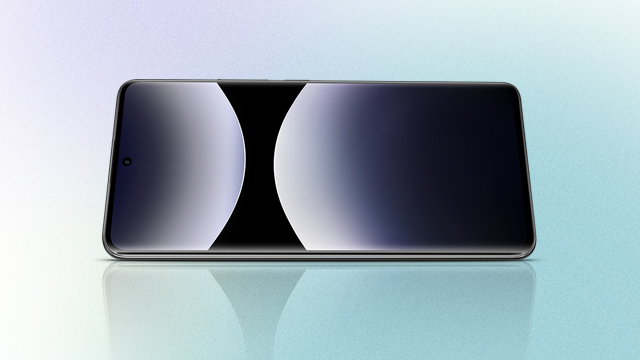 Un smartphone horizontal sobre una superficie reflectante muestra un diseño abstracto en blanco, negro y gris en su pantalla.