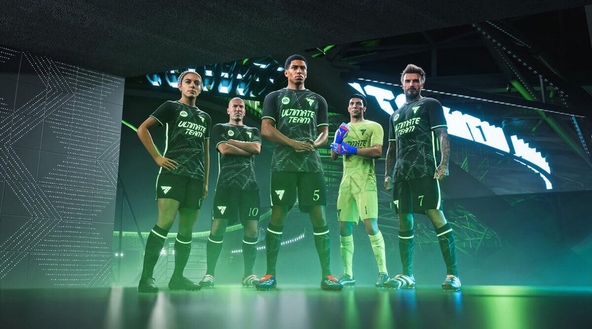Cinco jugadores de fútbol con equipaciones negras y verdes posan frente a un fondo abstracto iluminado en verde.