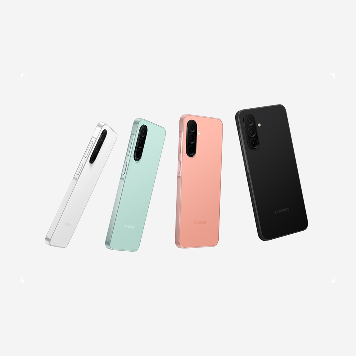 Cuatro teléfonos móviles en blanco, verde, rosa y negro, alineados en diagonal sobre un fondo blanco.
