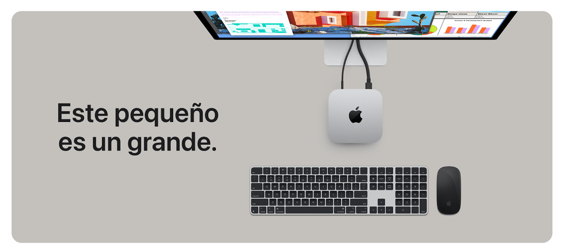 Escritorio gris con monitor, Mac Mini, teclado y ratón negros. Texto: "Este pequeño es un grande".