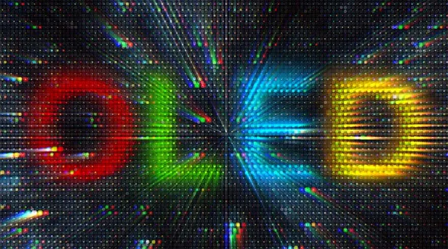 Texto "OLED" en rojo, verde, azul y amarillo sobre un fondo negro con un patrón de puntos brillantes y líneas de luz.