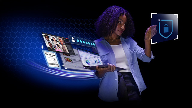 Una persona sostiene una laptop con múltiples pantallas flotantes y señala un escudo azul con candado.