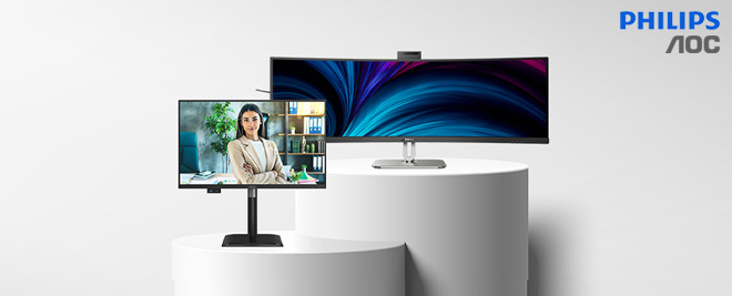 Monitores Philips y AOC sobre pedestales blancos, uno ultrapanorámico y otro con videollamada de una profesional, sobre fondo claro minimalista