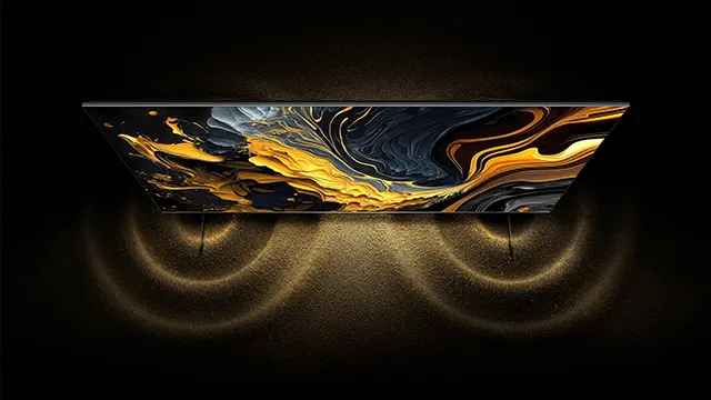 Televisor con patrón abstracto en tonos dorados, grises y negros. Debajo, luces curvas doradas proyectan reflejos sobre una superficie oscura.