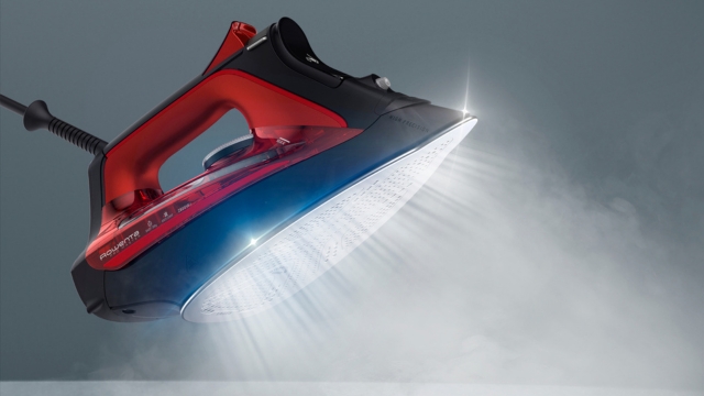 Aparato gris y negro con compartimento abierto y un filtro cilíndrico gris con bolas pequeñas al lado.