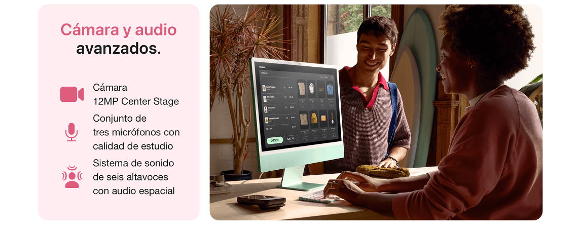 Dos personas interactúan frente a un ordenador color menta sobre una mesa. En pantalla se ven iconos de prendas.