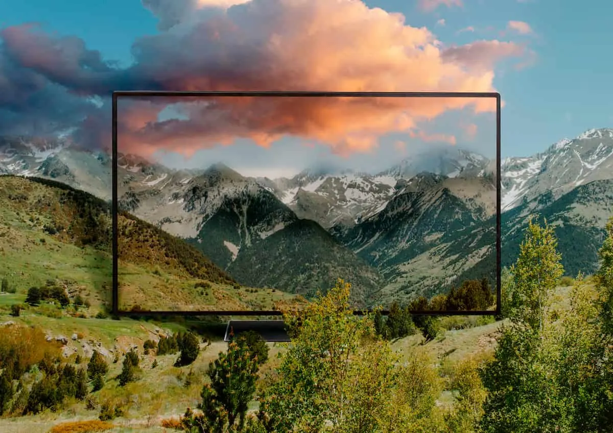 Televisor mostrando paisaje de montaña en alta definición.