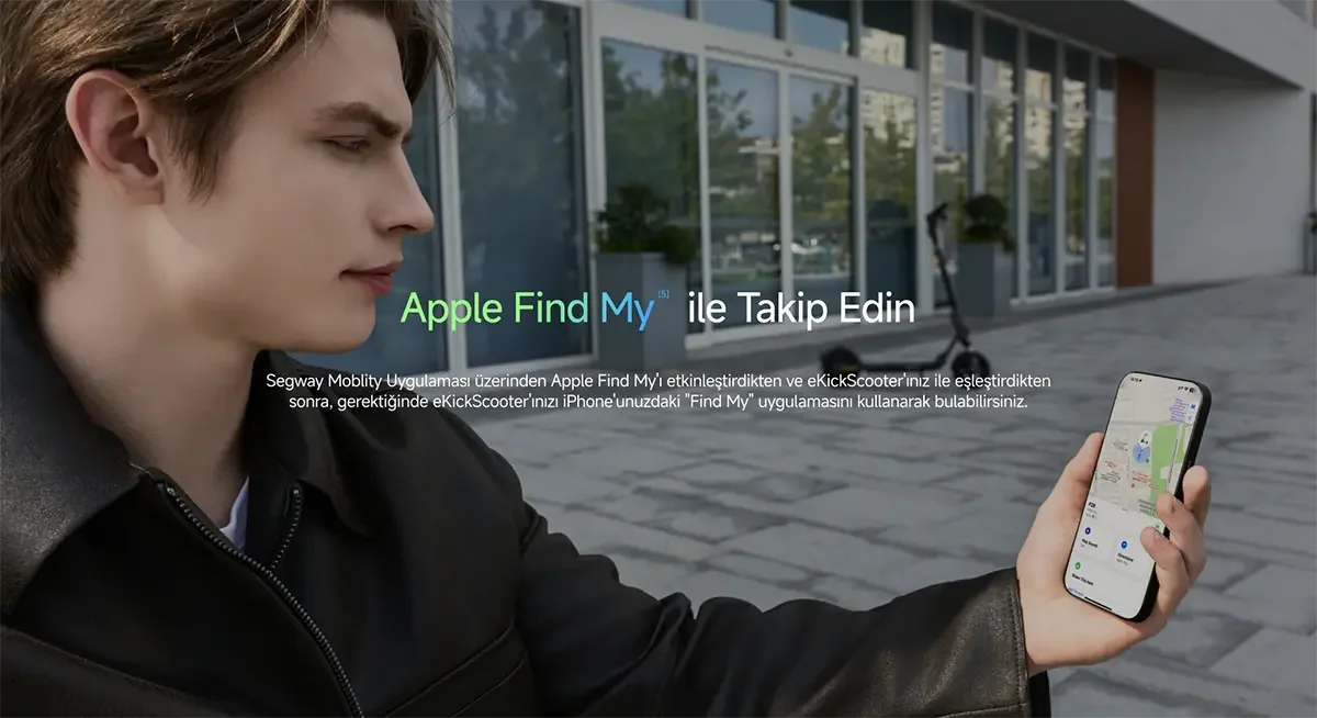 A person in the park is holding a cell phone, displaying a map app. An e-scooter and a building are visible in the background.