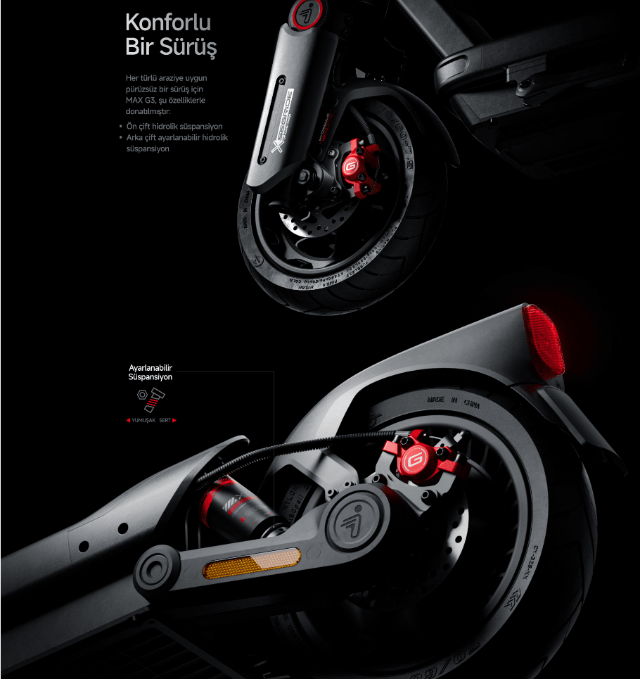 Siyah arka plan üzerinde, ön ve arka tekerlekleri görünen gri bir elektrikli scooter'ın yakın çekim görüntüsü. Frenler kırmızıdır.
